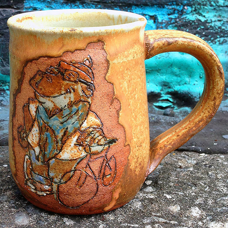 Pottery Mug of a Hipster Hippopotmous and his bicycle